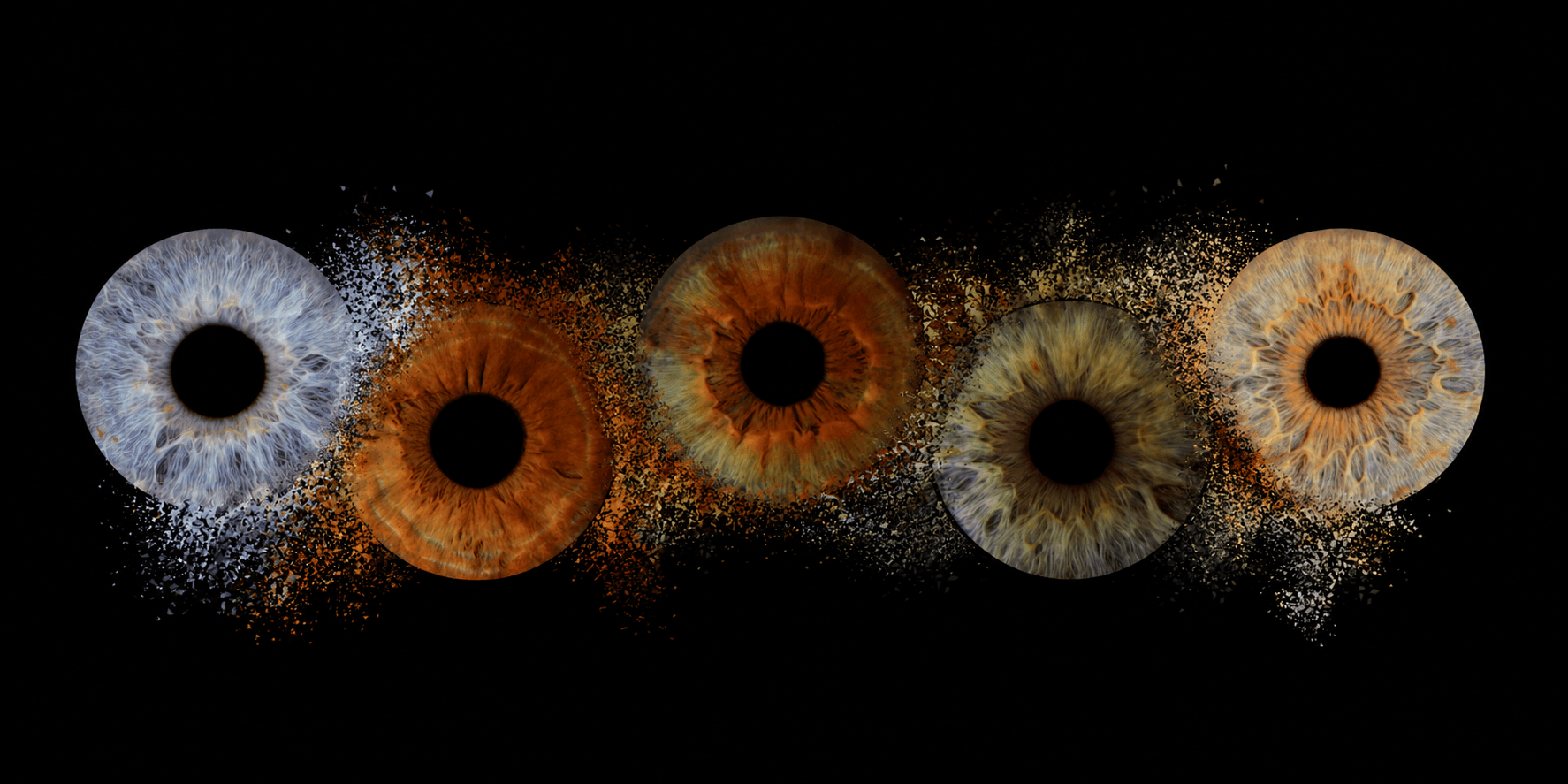 Five human irises of different colors disintegrating into fine particles against a black background.